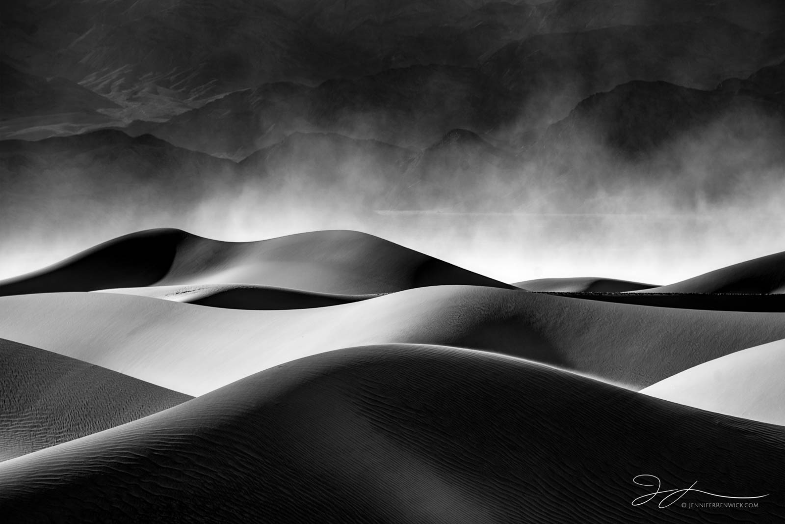 A windstorm on the Mesquite Sand Dunes whips up sand into the atmosphere.