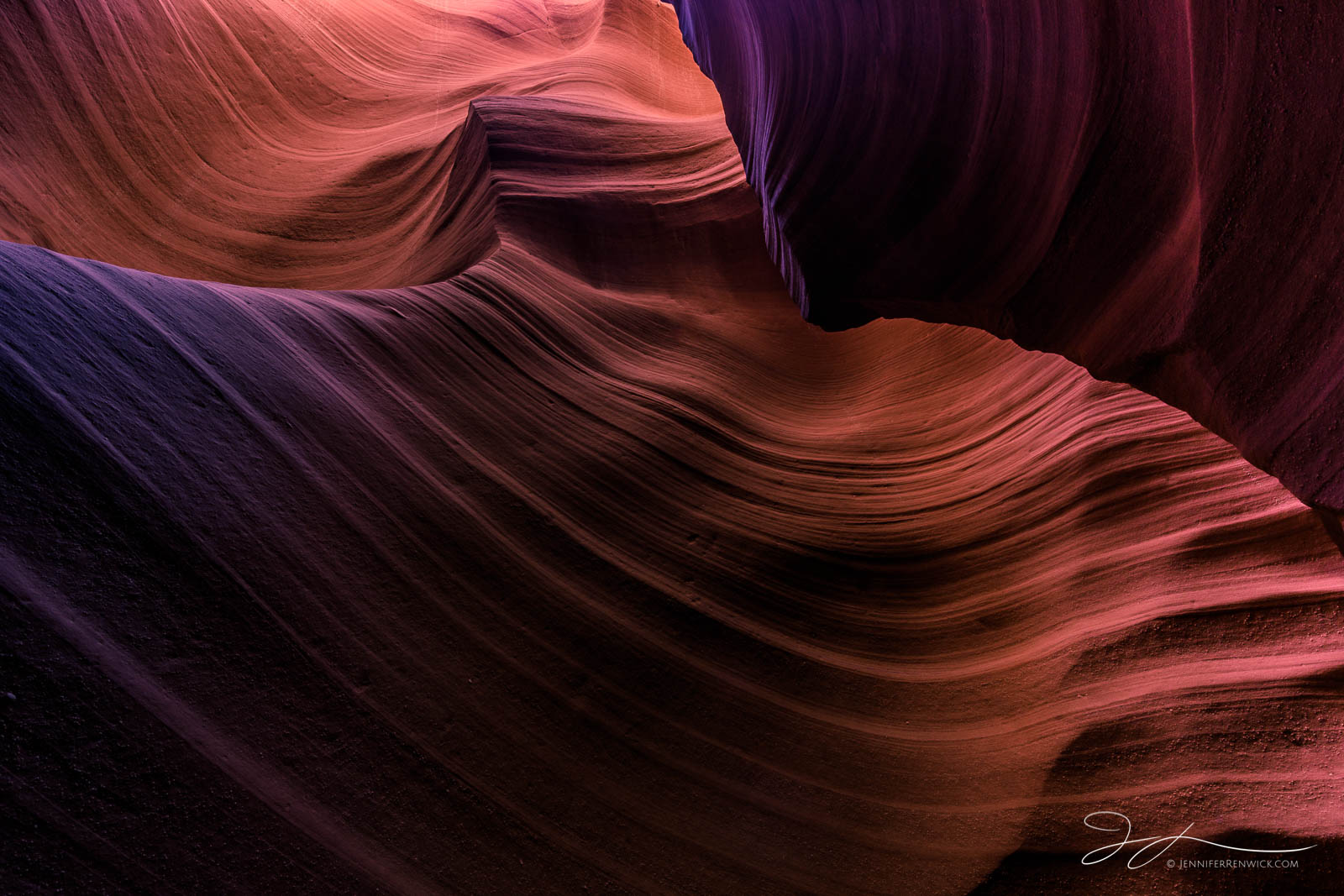 Colors, textures, and light paint the corner of a slot canyon.