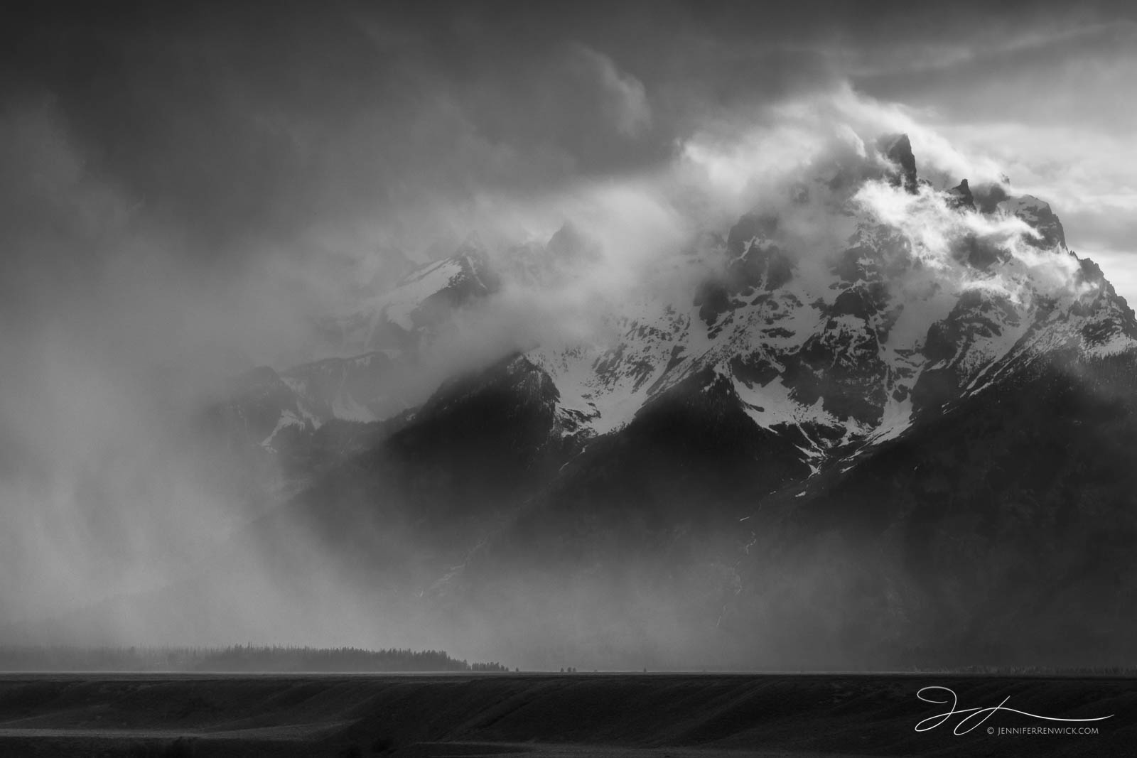 A storm clears and reveals the peaks of the Grand Tetons.