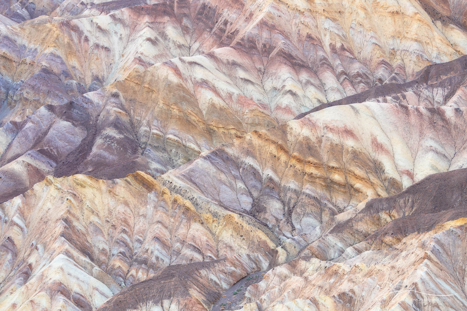 Layers and colors adorn the badlands at Zabriskie Point in Death Valley National Park.