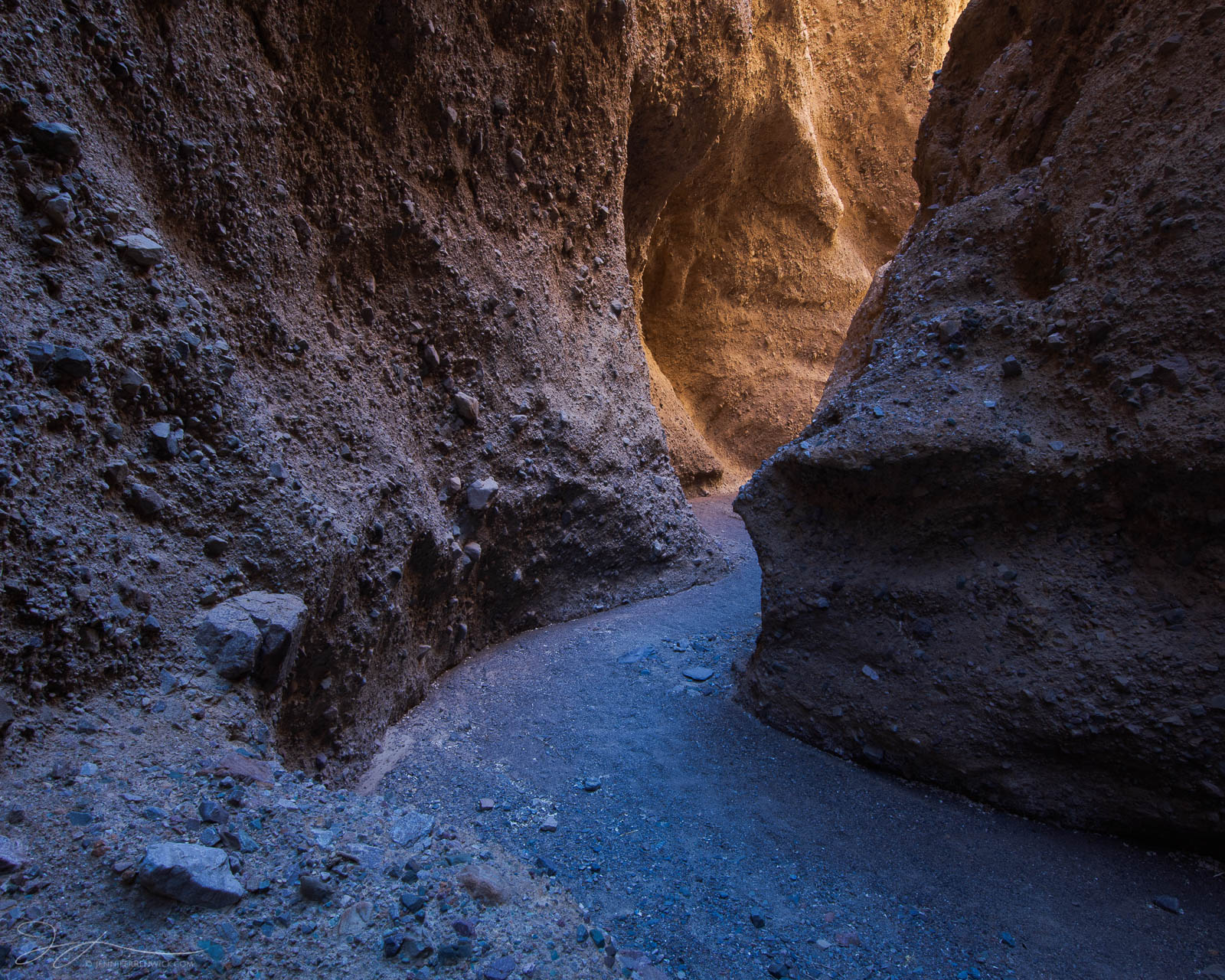 Follow the Glow Cool shadows and warm reflected light lead the way through a remote slot canyon in Death Valley National Park.