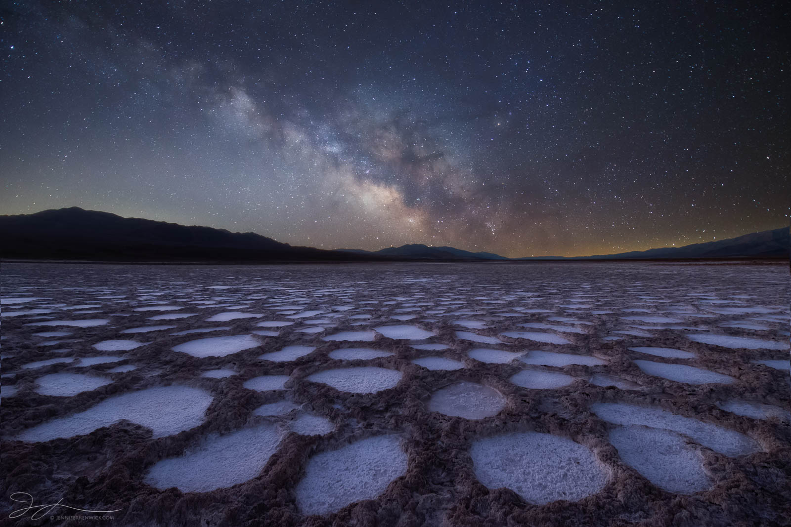 The Milky Way shines over alien formations in a playa in Death Valley National Park.