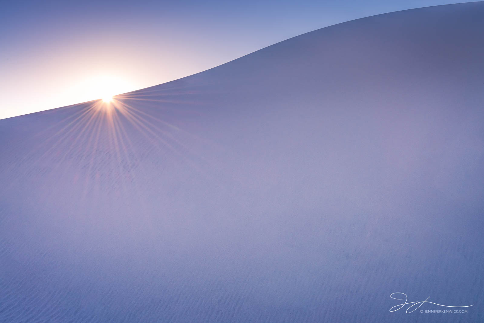 The sun sets behind a dune, reminding us a new day will come tomorrow.