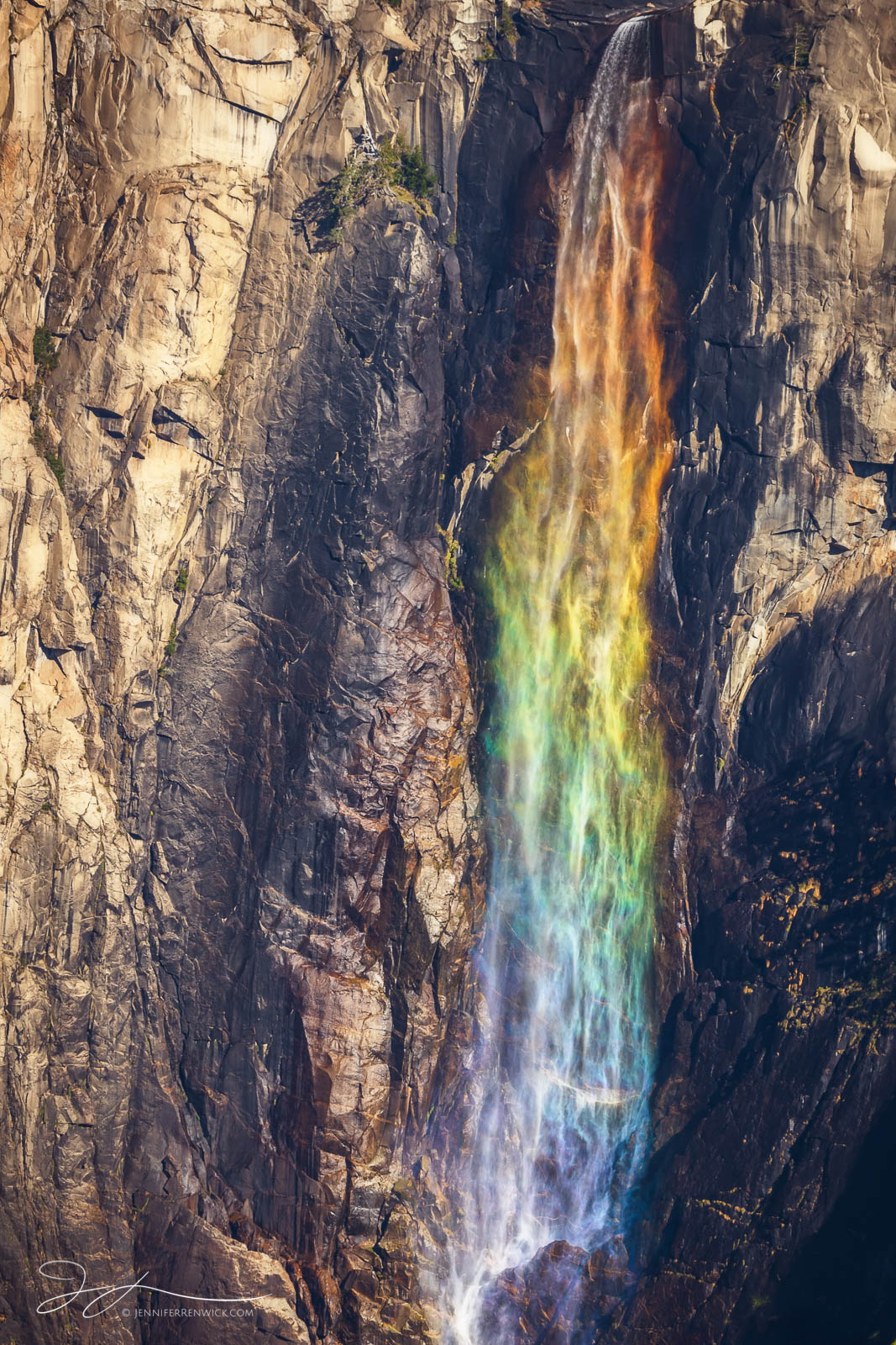 Bridalveil Fall in Yosemite National Park catches the light just right and transforms into a rainbow waterfall.