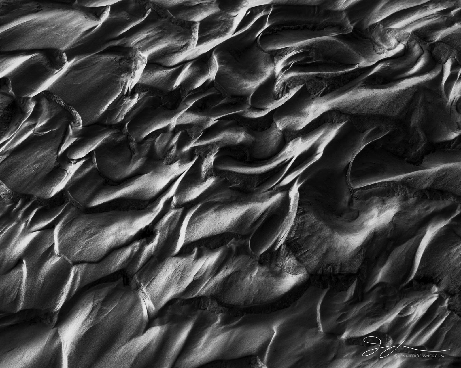 Dried, sandy mud forms a pattern resembling scales on a desert playa.  This image is part of my "Desert Textures" photo project...