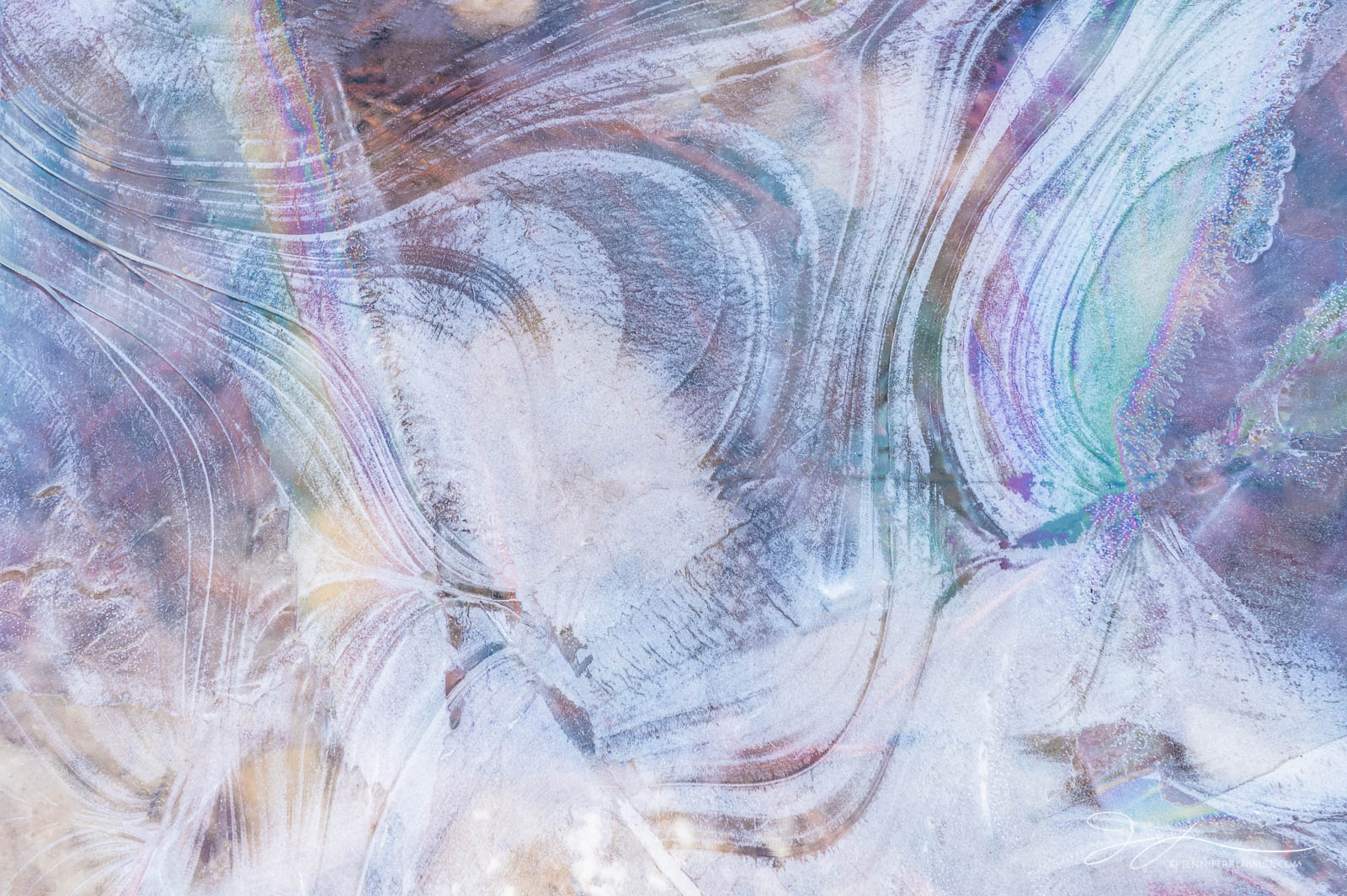 A patch of ice composed of refracted colors and lines resembles scribbles.