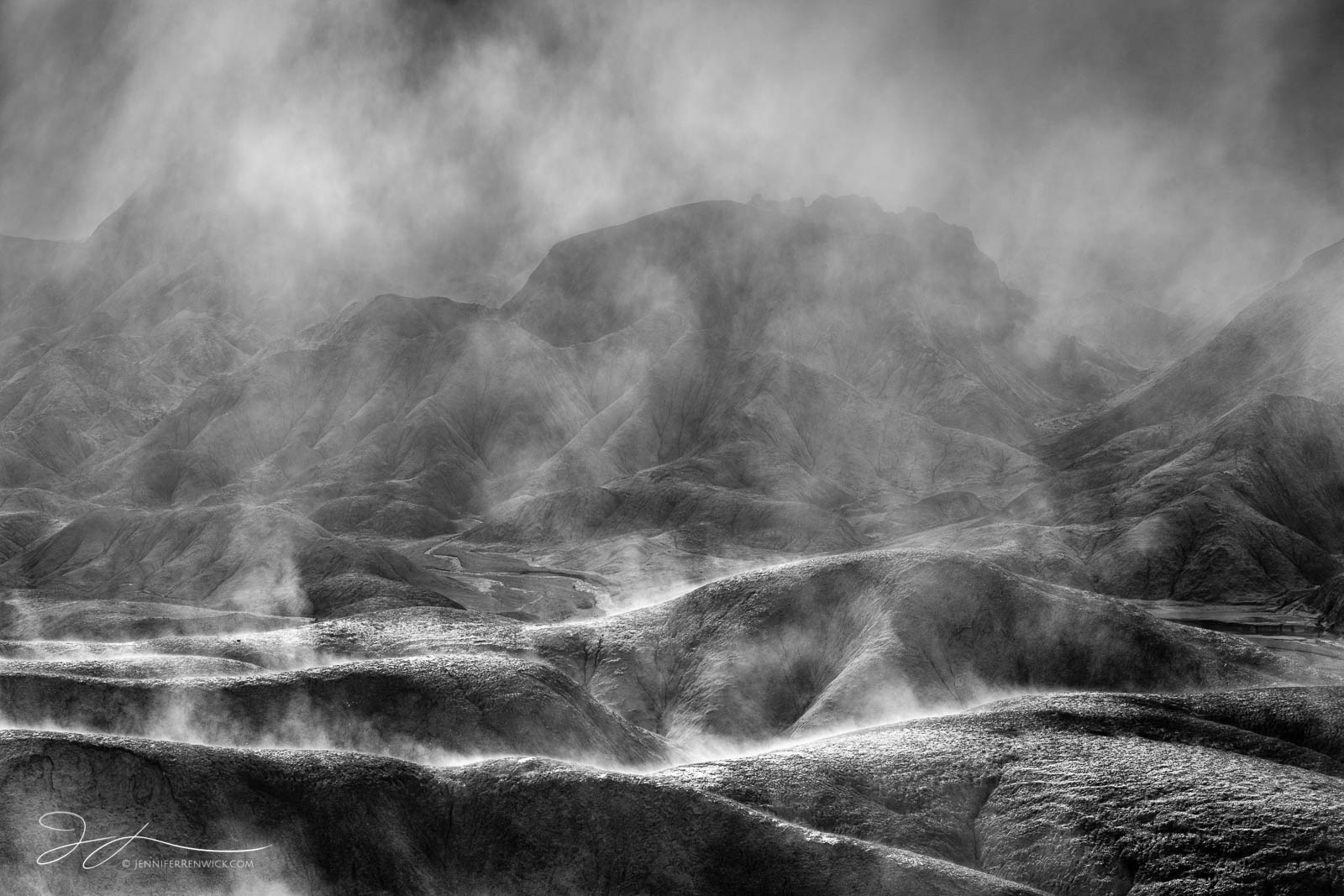 Sun highlights the ridges of the badlands in Death Valley National Park while the fog clears.  This image is part of my "Spirits...