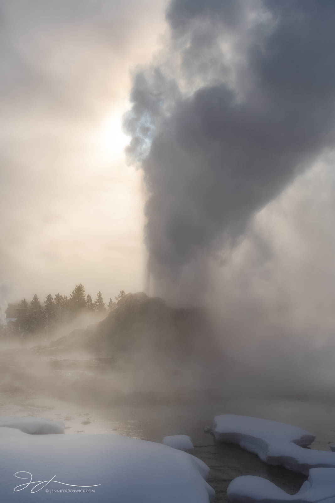 Castle Geyser erupts on a winter morning in the Upper Geyser Basin.